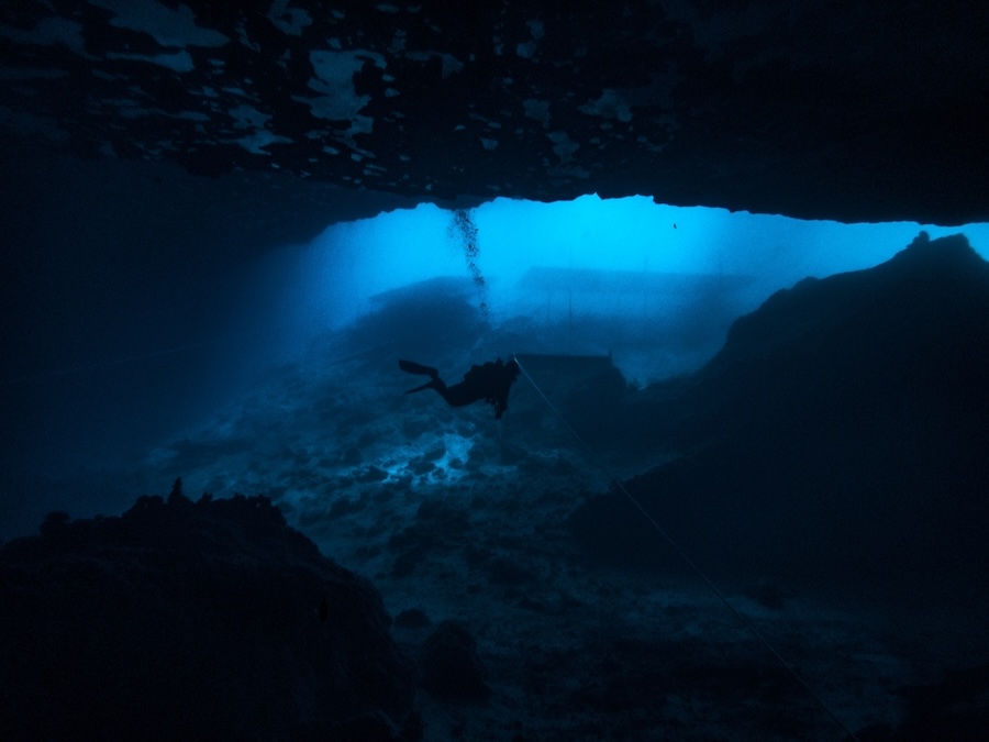 Sunlight illuminating the underwater cavern entrance in the sinkhole at Blue Grotto, Florida
