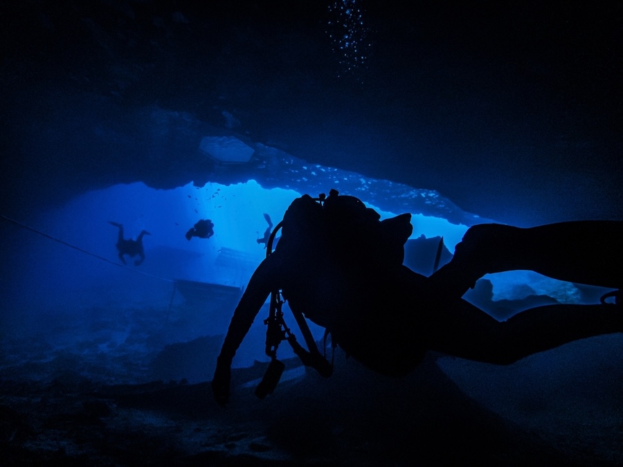 Sunlight illuminating the underwater cavern entrance in the sinkhole at Blue Grotto, Florida