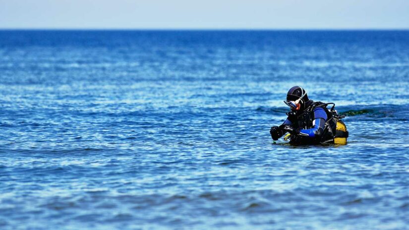 scuba diver surfacing