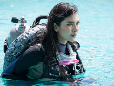 scuba diver using her gear