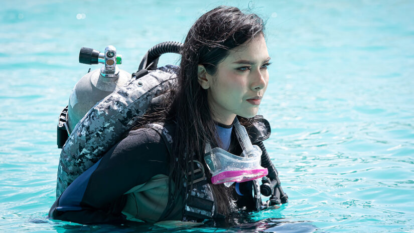 scuba diver using her gear