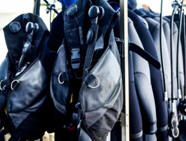 buoyancy compensator vests on a stand