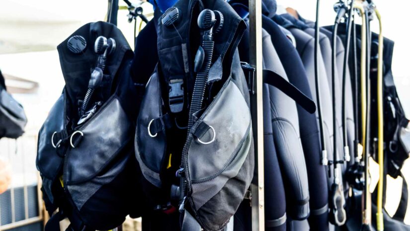 buoyancy compensator vests on a stand