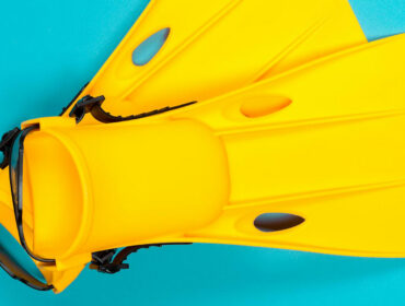 top view shot of yellow open-heeled fins