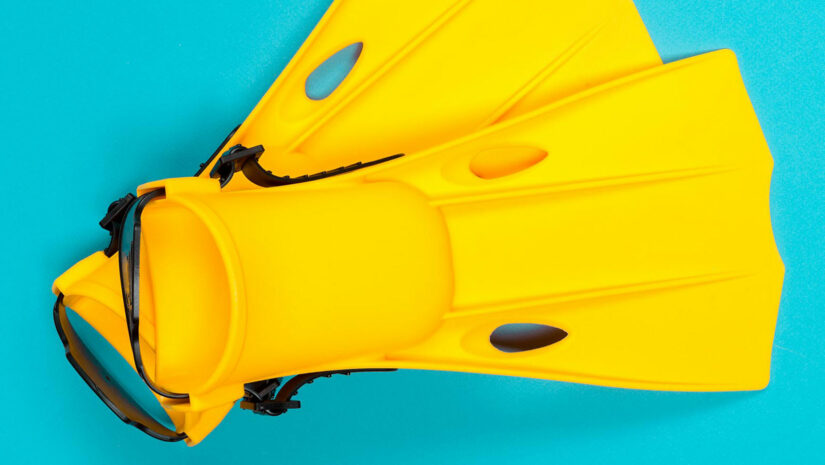 top view shot of yellow open-heeled fins