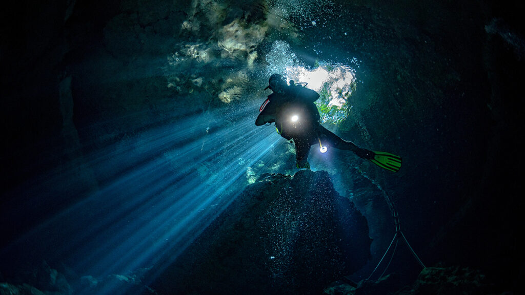 cave diving activity via Adobe stock