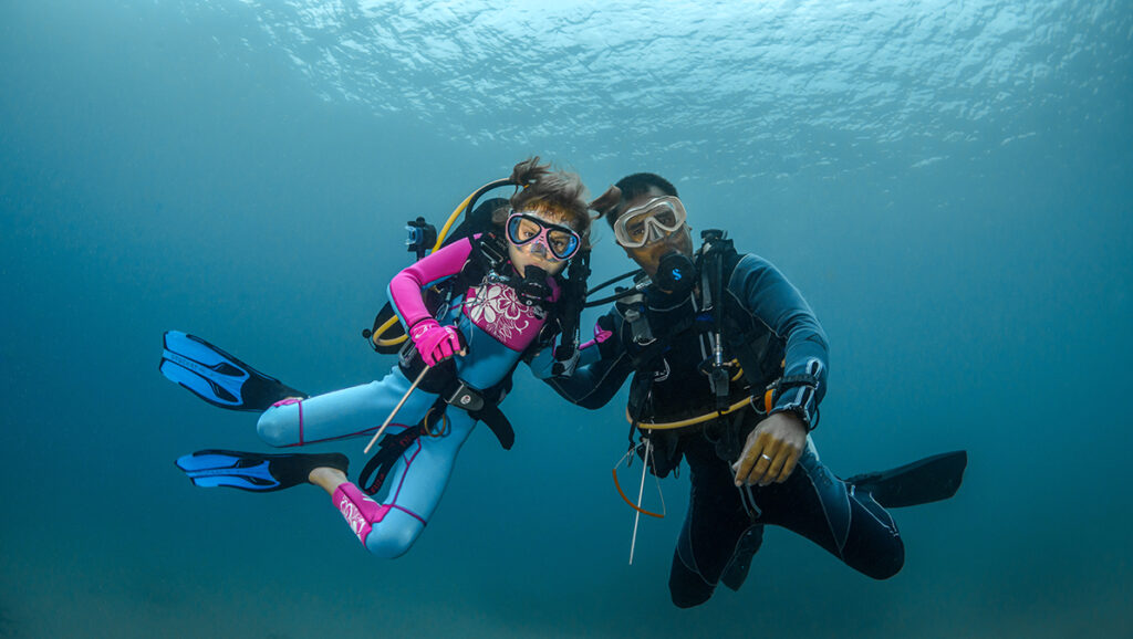 Image of a child learning to Scuba Dive via Adobe Stock