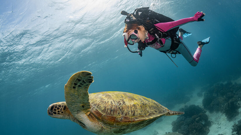 Image of a child Scuba Diving via Adobe Stock