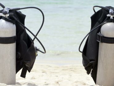 Two scuba tanks on the beach