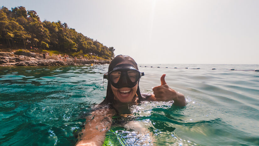 young woman snorkeling