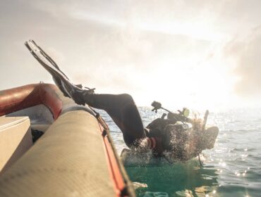 scuba diver executing the back roll