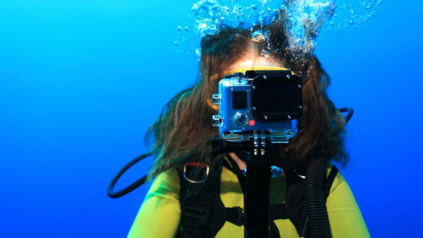 Scuba diver with underwater action camera