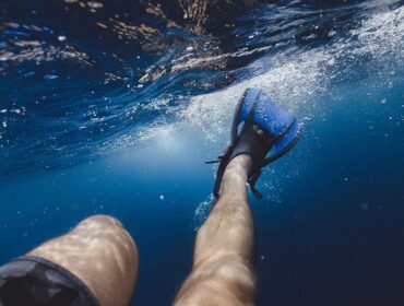 snorkeling fins on snorkeler underwater