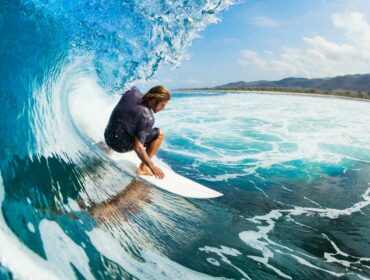 Male surfer in the middle of a wave