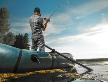 man fishing with an inflatable raft