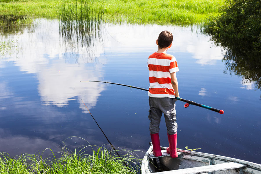 boy fishing on a clear day