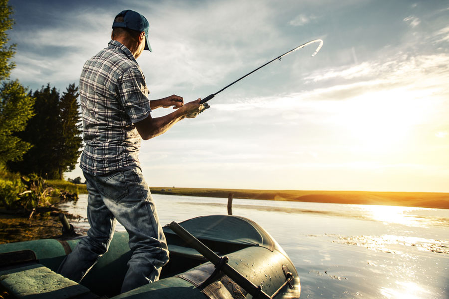 man reeling his big catch in