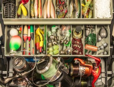 full tackle box with assorted fishing gear