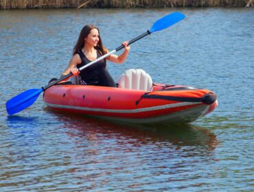 woman paddling in inflatable kayak