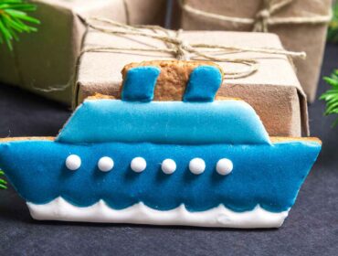 crafted one-dimensional boat with Christmas tree branches and gifts