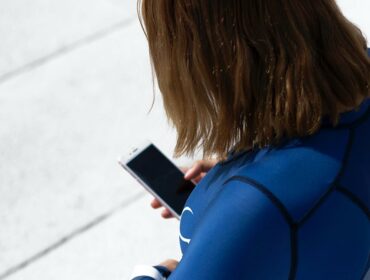 woman wearing wetsuit ready to dive