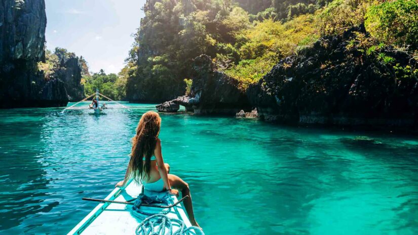 Female freediver cruising the waters around Coron