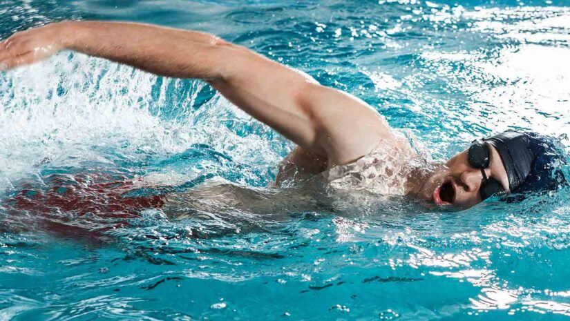 male swimmer inhaling during freestyle stroke