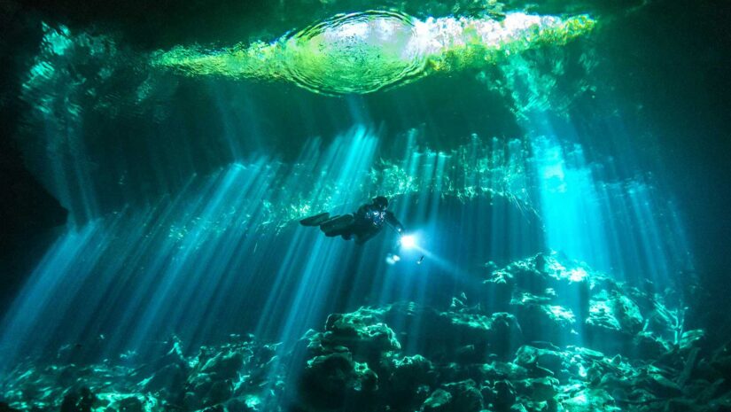 diver exploring a cenote in The Riviera Maya