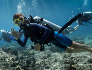 scuba diver making a hand signal