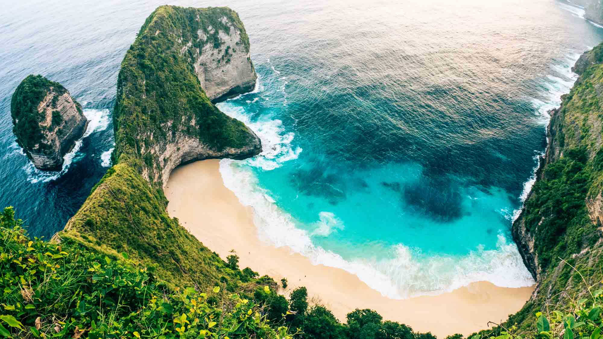 an aerial view of a coastline in Bali, Indonesia