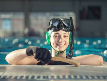 female underwater hockey player