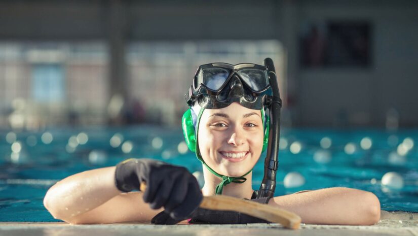 female underwater hockey player