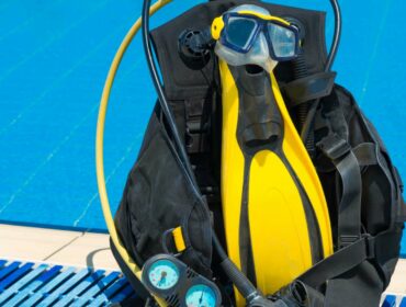 scuba equipment bag with different pieces of diving gear