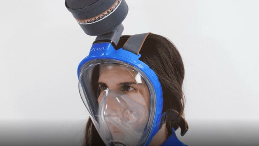 woman wears a modified full-face snorkeling mask from Ocean Reef