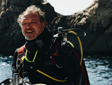 diver by the shore preparing to dive