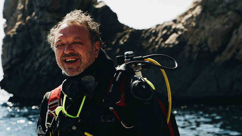 diver by the shore preparing to dive