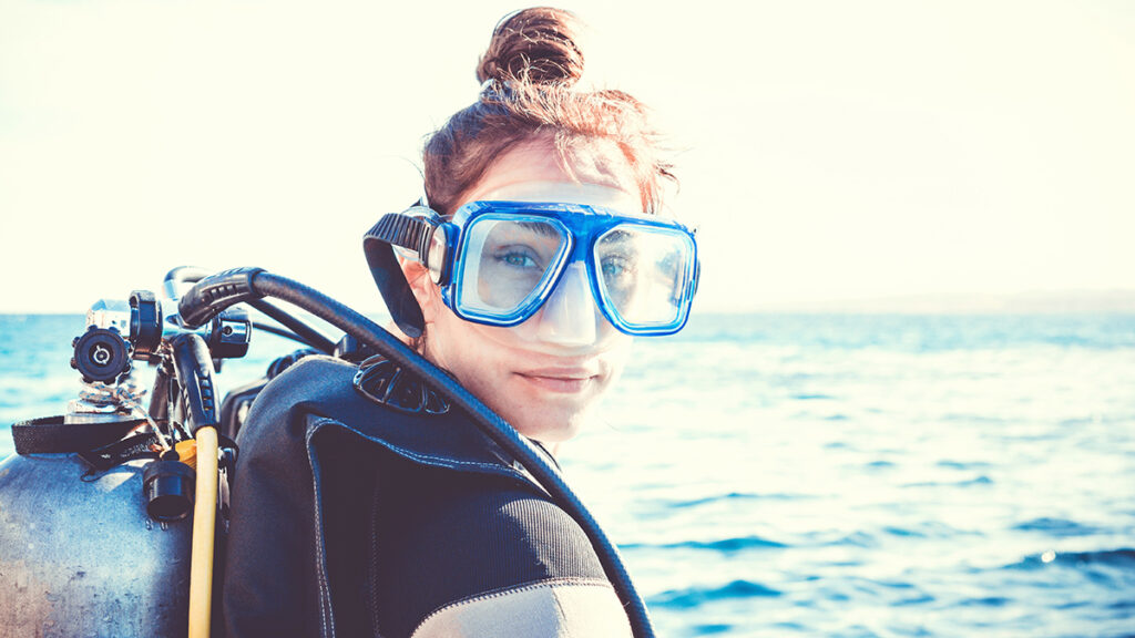Portrait of a young girl diver on a sunny day.