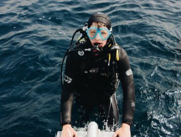 scuba diver entering water health benefits of scuba diving
