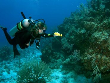 scuba diver with underwater flashlights