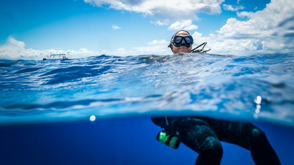 scuba diver surfacing from dive