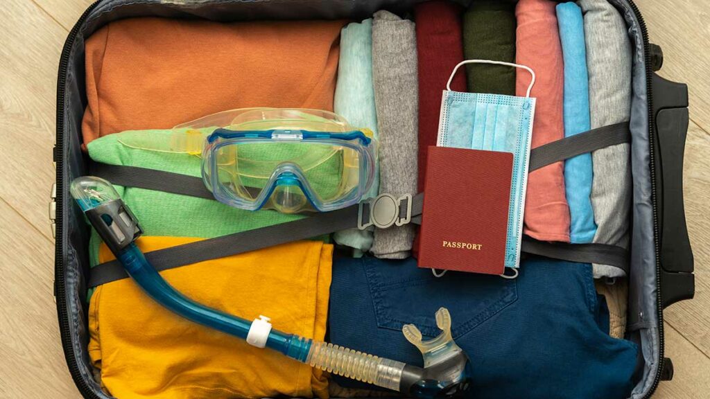 snorkeling gear in travel luggage