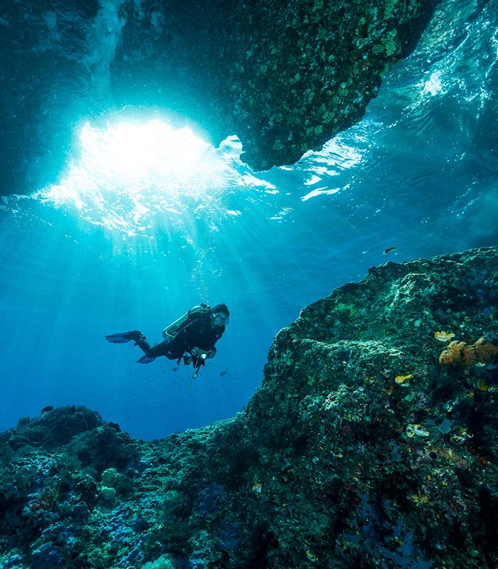 scuba diver in cave