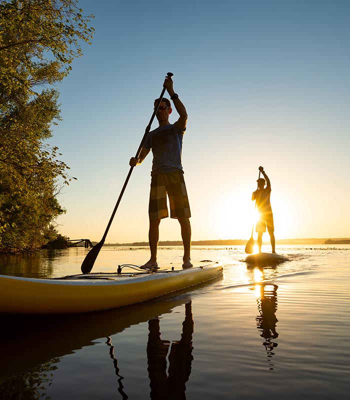 people paddleboarding on water
