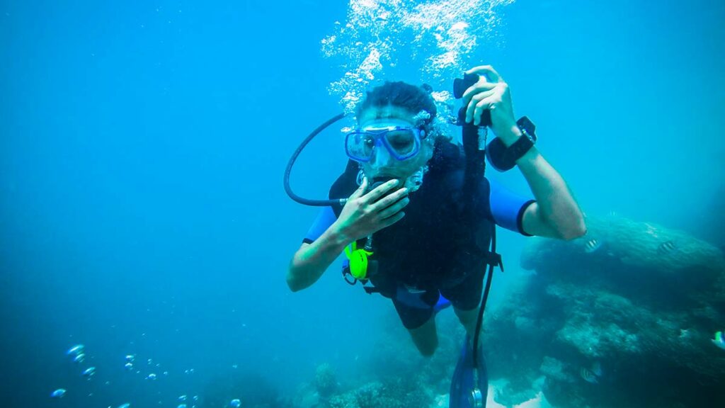 diver equalizing ears underwater