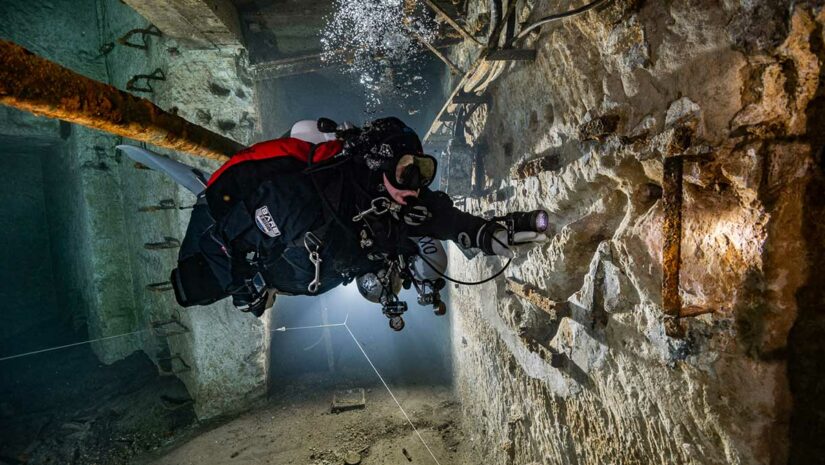 cold water diving underwater in bare drysuits