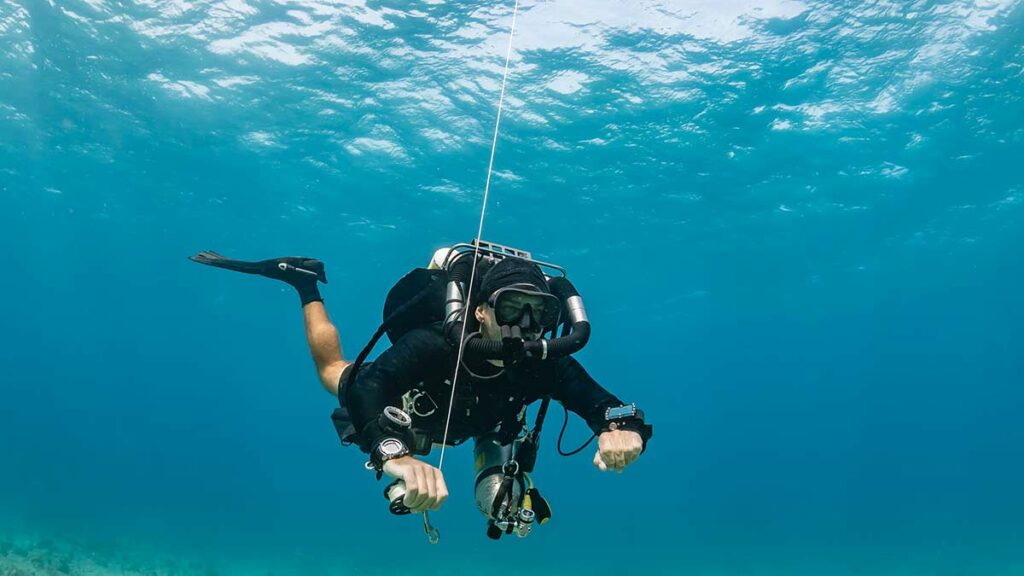 scuba diver doing rebreather diving underwater