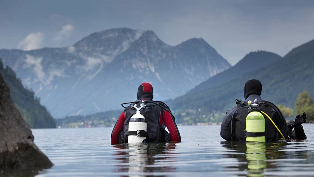 scuba divers altitude diving by mountain 