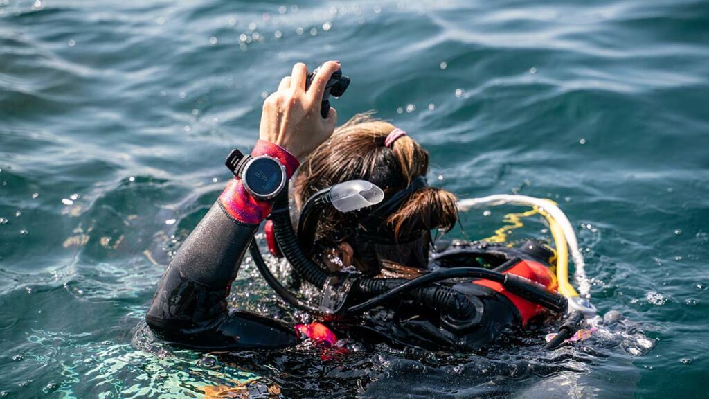 scuba diver with dive computers