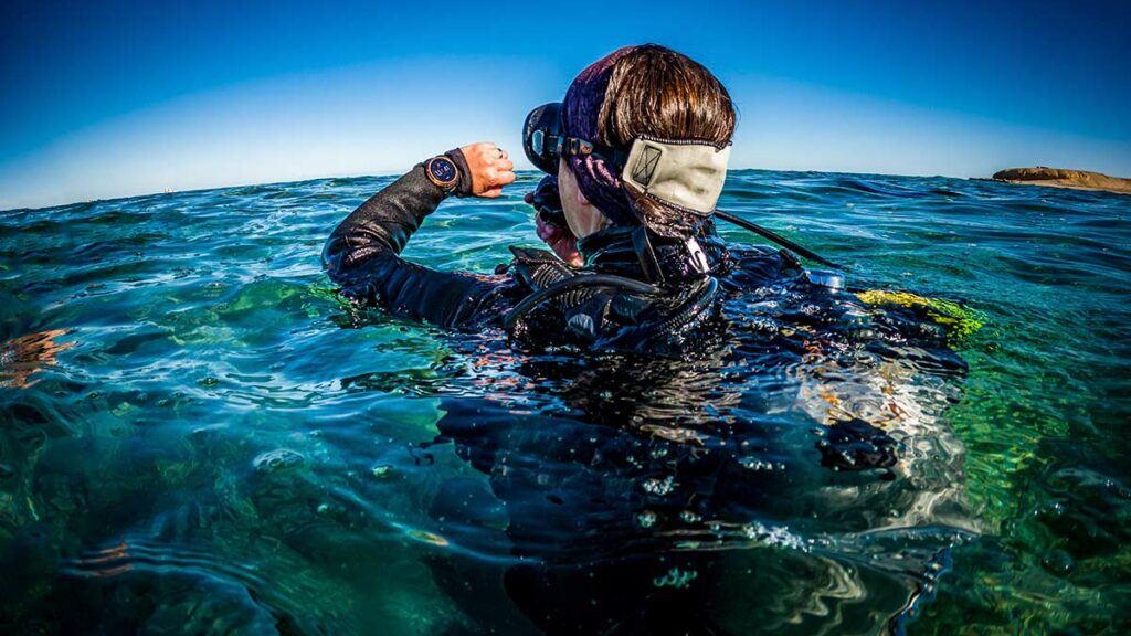 scuba diver with dive computers
