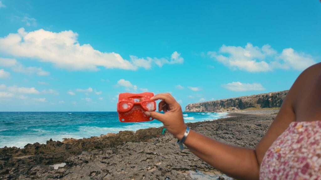 woman holding a piece of trash
